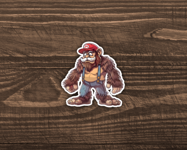 A sticker of Bigfoot as Mario on a wooden table